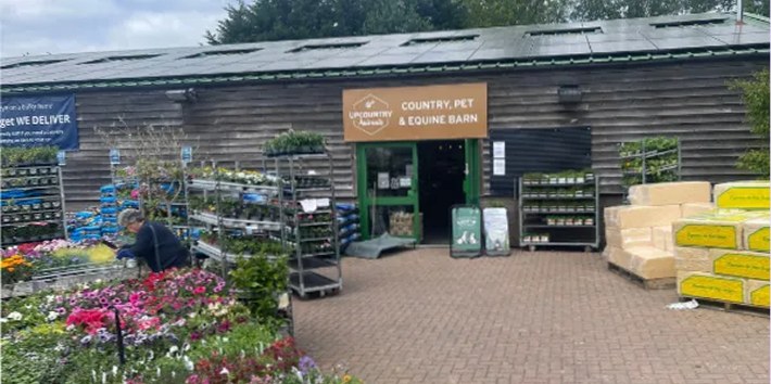 The Country, Pet & Equine Barn at UpCountry Scaynes Hill, with flowers and plants outside